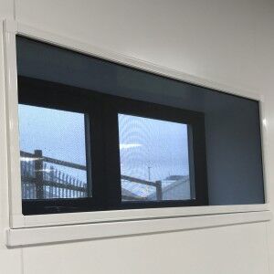 Magnetic fly screen fitted to a long commercial window