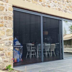 Plisse fly screens fitted across sliding patio doors