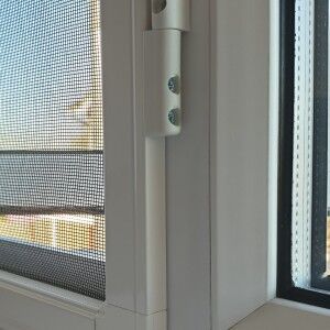 Hinged fly screen fitted inside a window frame
