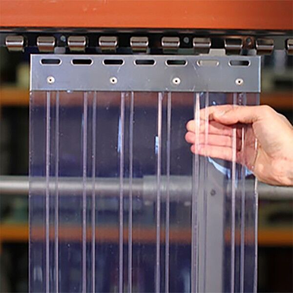Ribbed pvc strip curtain Hand parting ribbed clear PVC strips on a strip curtain door