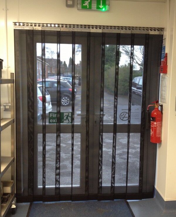 Heavy duty strip mesh fly door across a double doorway