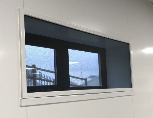 Magnetic fly screen fitted to a long commercial window